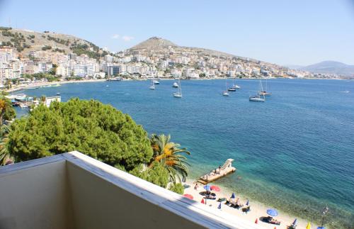 a view of a beach with boats in the water at Republika Hotel in Sarandë