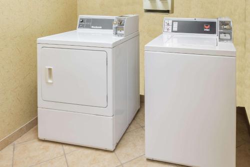 two white refrigerators are sitting next to each other at Baymont by Wyndham Asheville/Biltmore in Asheville