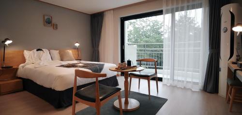 Voodi või voodid majutusasutuse The N Resort Hotel&Spa YangYang toas