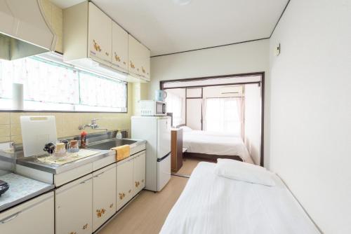 Kitchen o kitchenette sa COCOSTAY Felice ココステイ フェリーチェ