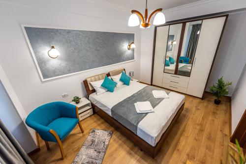 En eller flere senge i et værelse på Sunrise MAMAIA