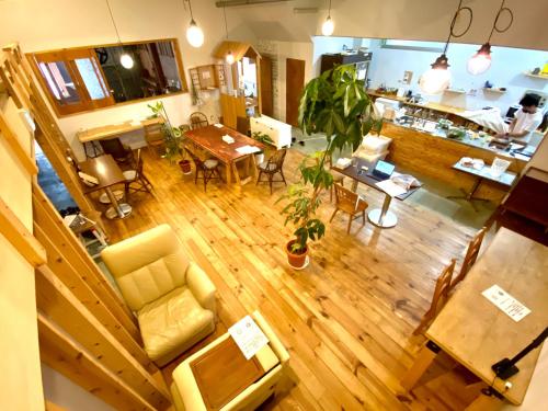 an overhead view of a living room and a dining room at Guest House MARUYA in Atami