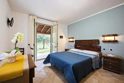 A bed or beds in a room at Agriturismo Il Fontanile