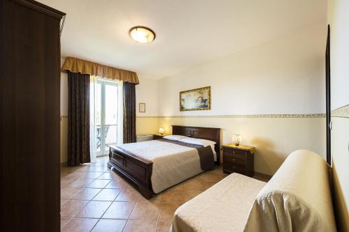 Ein Bett oder Betten in einem Zimmer der Unterkunft Agriturismo Il Fontanile