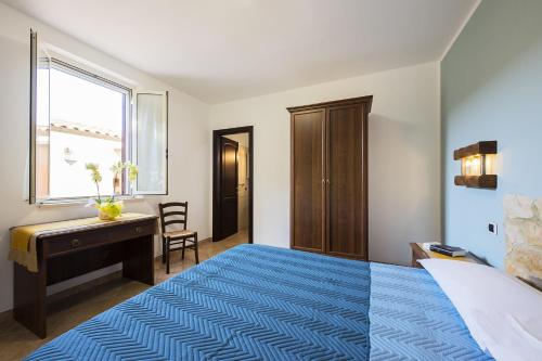 Ein Bett oder Betten in einem Zimmer der Unterkunft Agriturismo Il Fontanile