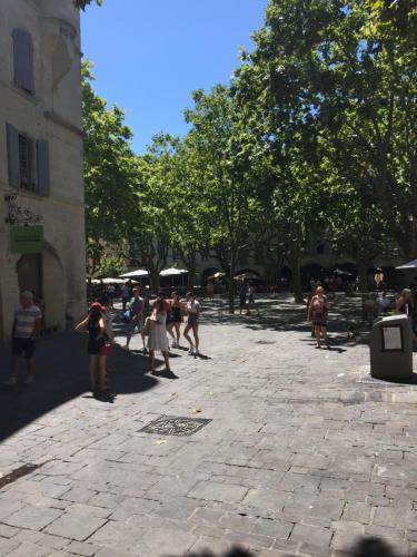 a group of people walking around in a street at B&B et Gite d'ayran in Saint-Quentin-la-Poterie