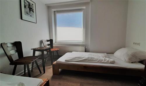 Ένα ή περισσότερα κρεβάτια σε δωμάτιο στο Ferienhaus Karl-Grüneklee
