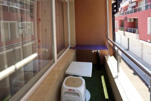 a room with a toilet in the middle of a building at Apartments Dani in Pomorie