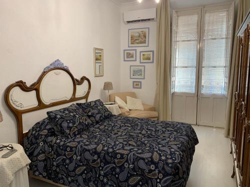 Ένα ή περισσότερα κρεβάτια σε δωμάτιο στο Corredera Rooms