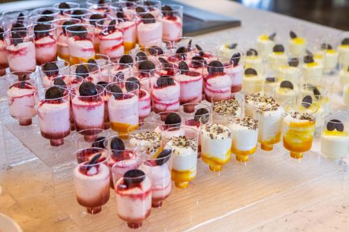 a row of glasses filled with different types of drinks at RVHotels Ametlla Mar in L'Ametlla de Mar