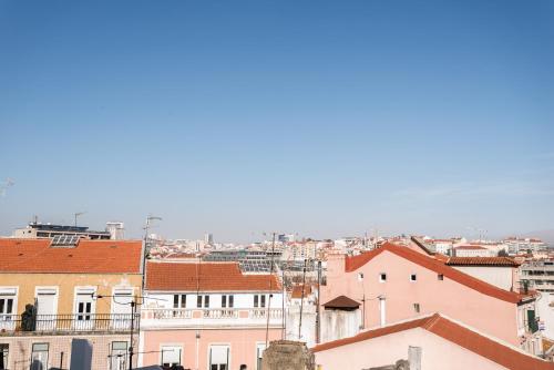 a view of a city with buildings at Hotel Botanico in Lisbon