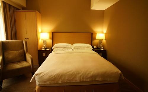 Кровать или кровати в номере City Suites-Taipei Nanxi