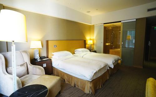 Кровать или кровати в номере City Suites-Taipei Nanxi