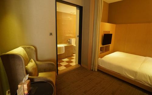 Кровать или кровати в номере City Suites-Taipei Nanxi
