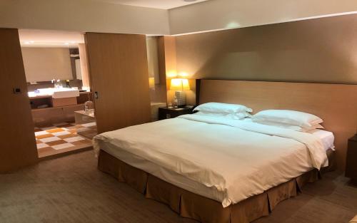 Кровать или кровати в номере City Suites-Taipei Nanxi