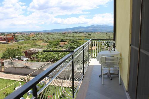 a balcony with a table and a view at B&B La Vigna in Lamezia Terme