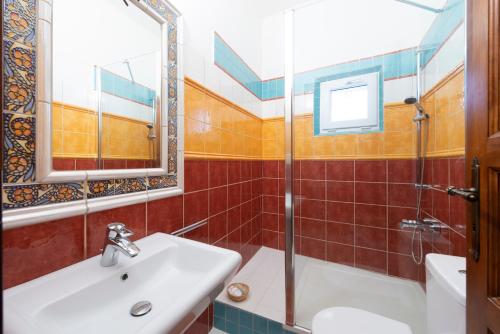 a bathroom with a sink and a shower at Hotel Barcadam in Banská Štiavnica