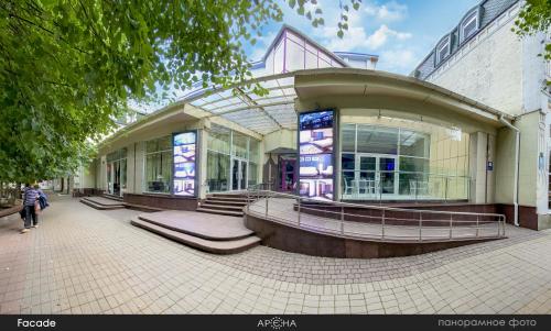 a large building with stairs in front of it at Arena in Khmelʼnytsʼkyy