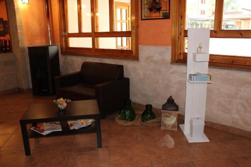 a living room with a couch and a coffee table at B&B La Vigna in Lamezia Terme