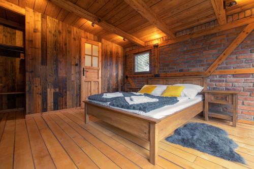 Tempat tidur dalam kamar di Dom Pod Lipą