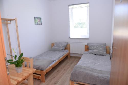 Postel nebo postele na pokoji v ubytování Villa Basia