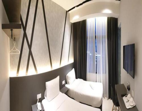Katil atau katil-katil dalam bilik di Suite Dreamz Hotel Banting