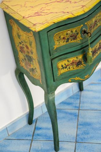 a green and yellow dresser sitting in a room at Palazzo Marzoli charme Resort - Small Luxury Hotel in Positano