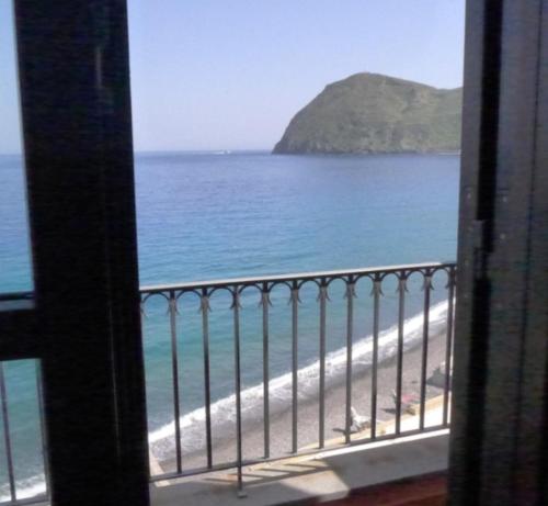 a view of the beach from a balcony at Casa Calandra in Canneto