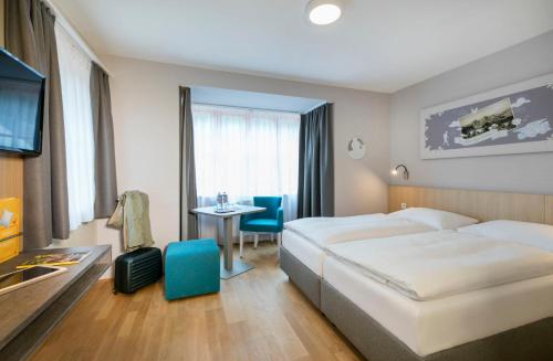 Postel nebo postele na pokoji v ubytování JUFA Hotel Eisenerzer Ramsau