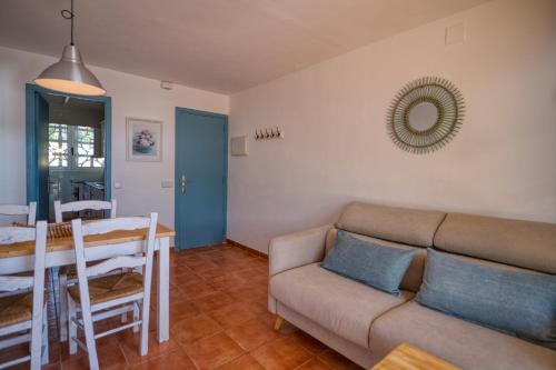 a living room with a couch and a table at Penyagolosa in Calella de Palafrugell