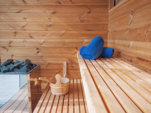 a wooden bench sitting on top of a wooden floor at Can Cota Boutique - Turismo de interior in El Port de la Selva