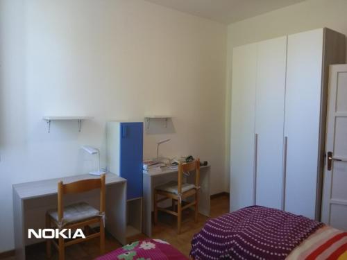 Ένα ή περισσότερα κρεβάτια σε δωμάτιο στο Villa Lilli 2