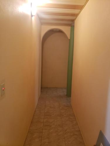 a long hallway with a ceiling and a light at CASTLE VIEW VILLA in Diamond
