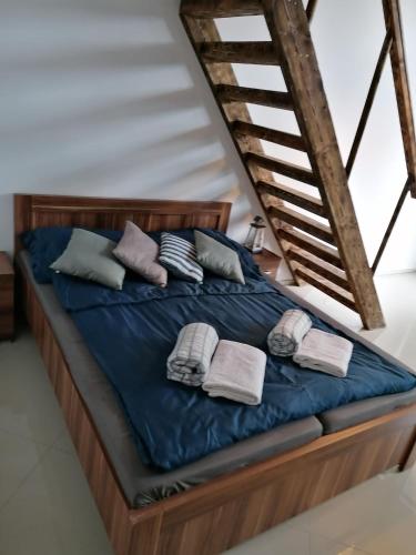 a bed with towels and pillows on it in a room at Wiking in Turawa