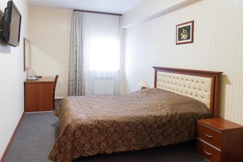 En eller flere senge i et værelse på U Istoka Hotel