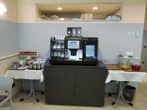 a kitchen with a coffee maker on top of a counter at Hotel Motel 2 in Castel San Giovanni