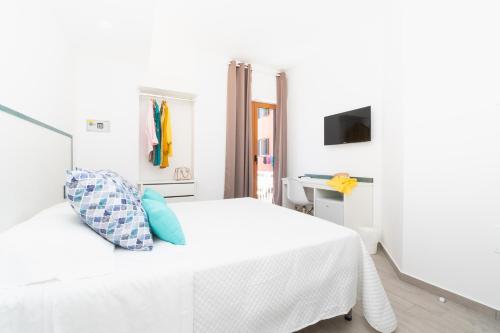 Ένα ή περισσότερα κρεβάτια σε δωμάτιο στο Sapphire Rooms