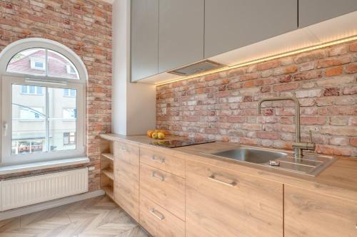 Кухня или мини-кухня в Dom & House - Apartments Quattro Colori
