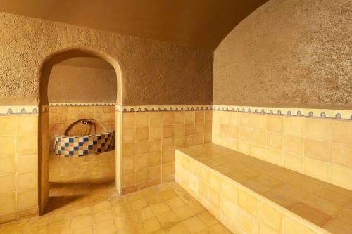 a bathroom with a tub and a sink in a room at Borjs Hotel Suites & Spa in Agadir