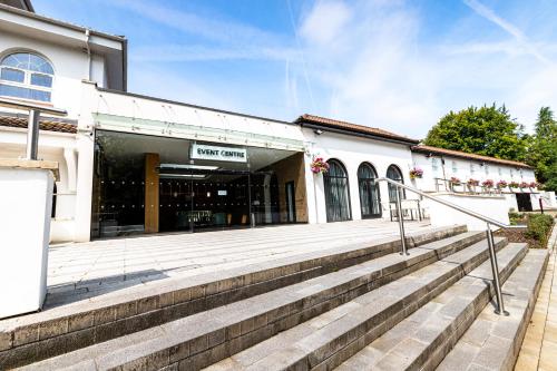 a building with stairs in front of it at Crowne Plaza Gerrards Cross by IHG in Beaconsfield