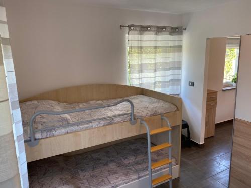 מיטה או מיטות בחדר ב-Apartma Lavanda