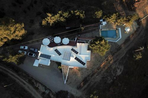 an overhead view of a house with solar panels at Made iN2 Creative Guest House in Montargil