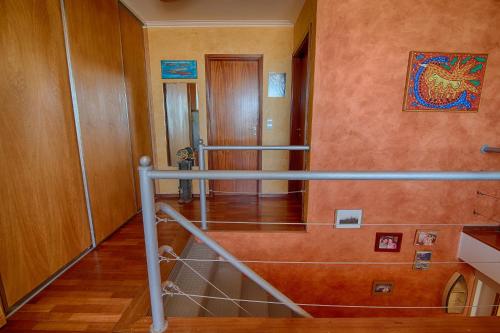 a hallway with a staircase in a house at House In Aguda Beach, praia da Aguda, in Aguda