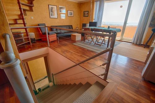 an overhead view of a living room with a staircase at House In Aguda Beach, praia da Aguda, in Aguda