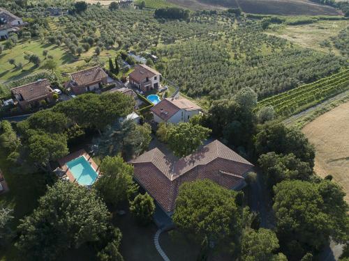 an aerial view of a house with a swimming pool at Villa Barbara in Santa Luce