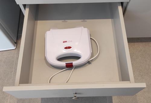 a white machine in a box on the floor at Milva Apartments in Kos Town