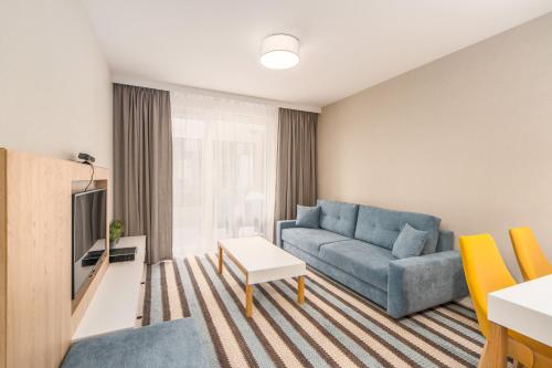 A seating area at Bel Mare Apartments by Renters