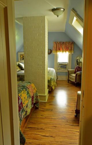 a room with two beds and a living room at Fisherman's Daughter B&B in Mahone Bay