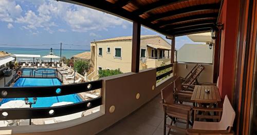a balcony with a view of a swimming pool at Medusa's Villas in Acharavi