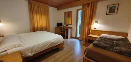 Cama o camas de una habitación en Hotel Diana